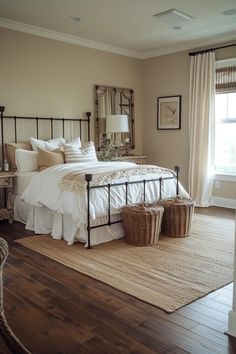 a bedroom with a large bed and two baskets on the floor