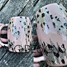 two pink coffee mugs with silver glitter designs