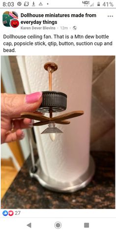 someone is holding a toy airplane on top of a counter with the caption dollhouse miniatures made from everyday things