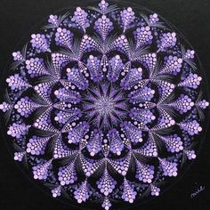 a painting of purple flowers in the middle of a black circle with white dots on it