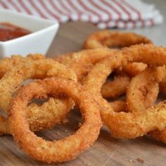 some onion rings are sitting on a cutting board