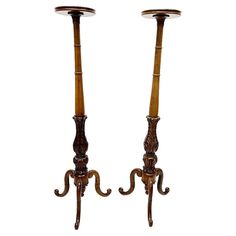 two wooden candlesticks sitting next to each other