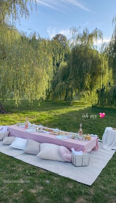 a picnic table set up in the middle of a field