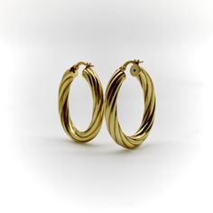 These 14k gold vintage hoops are a great pair of everyday earrings. The larger size of the hoops gives these earrings a great visual presence, while their hollow-construction allows them to remain lightweight. These make for a sophisticated staple piece in any collection--we’ve paired them with earring enhancers to show how these earrings can be used to create a variety of looks.   The ovals measure  1 3/8” x 1 1/16”, with a width of 4.62 mm. Combined, the earrings weigh 3.5 grams. They are marked on the earring stem with 14K, Italy, and a hallmark of a B within a circle.   The earrings are in very good condition. Because of their hollow nature, one of the earrings has two very small indentations. The indentations are hardly noticeable and do not detract from the earrings, but we wanted to Timeless Oval Tarnish Resistant Earrings, Timeless Oval Hoop Earrings As Gift, 14k Gold Oval Hoop Earrings Timeless Style, Timeless Oval Hoop Earrings With Polished Finish, Timeless Oval Tarnish-resistant Earrings, Oval 14k Gold Hoop Earrings Timeless Style, Elegant 14k Gold Oval Hoop Earrings, Classic Oval Tarnish Resistant Earrings, Timeless Oval 14k Gold Hoop Earrings