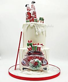 a three tiered cake with presents on top