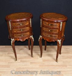 two small wooden tables with drawers on each side