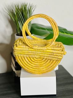 The Ọnwa Raffia Handbag – House of Okara Yellow Top Handle Shoulder Bag With Braided Handles, Chic Yellow Crochet Tote Bag, Chic Palm Leaf Bucket Bag, Natural Straw Basket Bag With Detachable Handle, Yellow Woven Top Handle Shoulder Bag, Yellow Top Handle Beach Bag, Yellow Top Handle Straw Bag For Shopping, Yellow Top Handle Shoulder Bag For Vacation, Chic Bamboo Handle Bag For Market