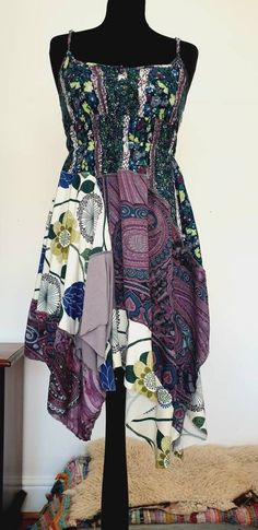 One of a kind very pretty boho floral dress in tones of purple, greens and blues. Made entirely using upcycled fabrics :) this dress fits a uk size 8-12. Bohemian Purple Floral Print Maxi Dress, Bohemian Maxi Dress With Floral Patchwork, Bohemian Purple Patchwork Dress, Purple Bohemian Dress With Floral Print, Bohemian Purple Dress With Patchwork, Purple Boho Print Dress For Festivals, Purple Patchwork Summer Dress, Purple Patchwork Sleeveless Dress, Purple Bohemian Dress With Boho Print