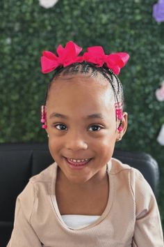 This nice hairstyle has clean, straight-back braids that give a traditional and neat look for any young kid. Adding some fun, the braids have colorful beads on the ends, which not only keep the braids together but also add a bit of enjoyment to the style. Finished with a bright, big pink bow, this hairstyle is just right for giving a little - Click to see more of 20 Cute Cornrow Hairstyles for Little Ones and follow us for more hairstyle ideas. // Photo Credit: Instagram @catch.dees.handz Straight Back Braids, Nice Hairstyle, Back Braid