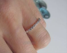 Sterling Silver CZ ring, half eternity - promise ring - simple ring, sweet ring - Womens - enhancer Top of Ring Height: 2.2mm Band Width: 1.5mm Shank Width: 1.6mm Stone Material: Clear Cubic Zirconia Stone Shape: Round Total Number of CZ Stones: 14 Stone Setting: Prong Metal: 925 Sterling Silver Plating: Rhodium plated Finish: High Polish Metal is solid 925 Sterling silver, High polished, with rhodium plating Email me if you have any questions. Anniversary Midi Rings With Prong Setting, Classic Cubic Zirconia Midi Rings For Anniversary, Promise Diamond Ring With Channel Set And Open Ring, Channel Set Diamond Open Ring For Promise, Channel Set Diamond Promise Ring, Channel Set Diamond Promise Ring, Open Design, Anniversary Midi Rings With Bezel Setting, Minimalist Channel Set Stackable Promise Rings, Minimalist Channel Set Round Diamond Ring