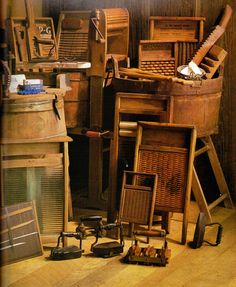 a pile of old wooden furniture sitting on top of a hard wood floor