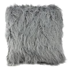 a gray furry pillow on a white background