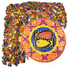 an image of a colorful circle made out of small pieces of mosaic tile with the letter c on it