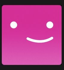 a pink square with a smiley face drawn on it's front and back sides