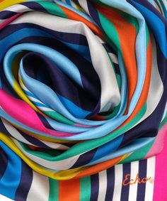 This versatile 100% silk scarf adds an accent in bold colors or striking neutrals. Tie it around the neck, wear it as a flowing head wrap, or even transform it into an eye-catching summer top. Dimensions: 13 in. x 72 in. Materials: 100% Silk Elegant Multicolor Scarves For Summer, Elegant Multicolor Summer Scarves, Trendy Multicolor Silk Scarf, Multicolor Silk Scarf For Spring Beach, Chic Multicolor Beach Scarves, Elegant Multicolor Beach Scarves, Elegant Multicolor Beach Scarf, Chic Multicolor Summer Scarves, Chic Multicolor Scarves For Summer