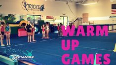 some girls in bathing suits are standing on a blue mat with the words warm up games