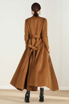 "This brown wool coat gives you the fall winter feels! Everything you need in a perfect midi wool coat is here. The wool coat to wear this season to work events, and out and about town....and now the search is over! It has been meticulously tailored with superior wool fabric that will keep you warm all season long. Every woman needs a wool coat in her wardrobe! DETAIL * Perfect Match with your favorite leggings, black slacks, denim jeans, etc * 50% wool blend, 50% fiber,nylon * Fully satiny lini Brown Single Breasted Wool Coat For Spring, Single Breasted Brown Wool Coat For Spring, Long Solid Wool Coat For Fall, Brown Single-breasted Wool Coat For Spring, Solid Color Long Wool Coat For Fall, Brown Single-breasted Wool Coat For Winter, Long Brown Wool Outerwear, Brown Long Sleeve Wool Coat For Fall, Elegant Brown Wool Coat With Long Sleeves