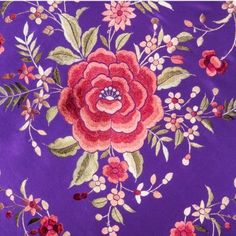 a purple background with red flowers and green leaves