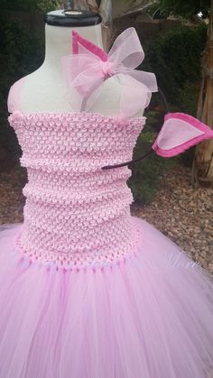 These fun, costume tutus will make you feel like the princess you are! All dresses have 2 solid layers of tulle tied around a crocheted tutu tube top. And can be made for sizes infant to size 12 in girls. Need something in a larger size? Lets redesign something that suits you! Don't see the costume you want? Just ASK! Don't want a dress or gown? No problem, i can convert any costume into a tutu skirt! Heaband included in price Visit me at www.facebook.com/christystutus to see more! Piglet Ears, Ballet Hair Accessories, Piglet Costume, Ballet Bun Wrap, Belle Tutu, Tutu Dress Pink, Pig Costume, Princess Tutu Dresses, Ballet Hairstyles