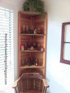 a corner shelf in the corner of a room