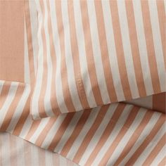 an orange and white striped sheet set