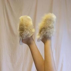 Pamper your feet and keep them snug, even on the coldest days, with these irresistibly soft slippers alpaca.Soft alpaca slippers are handmade by Peruvian artisans who deal with freezing temperatures in the Andean Highlands on a daily basis.The outer lining of these alpaca slippers is made from high quality alpaca wool; super soft. The inside is made of Merino wool: breathable, temperature-regulating, and odour-resistant.- Made of 100% Alpaca Suri.- Spot clean.- Alpaca wool outer lining.- Merino Cozy Beige Slip-on Slippers, Cozy Fluffy Slip-on Slippers, Fluffy Slip-on Cozy Slippers, Fluffy Slip-on Indoor Slippers, Fluffy Slip-on Slippers For Indoor Use, Cozy Faux Fur Slippers With Round Toe, Fluffy Comfortable Slip-on Slippers, Fluffy Slip-on Comfortable Slippers, Comfortable Fluffy Slip-on Slippers