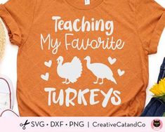 an orange shirt that says teaching my favorite turkeys with two birds on it and some flowers