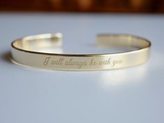 "Gold plated jewelry gives you the look and the style without the high price of pure gold. - Gold bracelet engraved with your chosen message. - The thickness of gold plating is around 0.5 microns - Text, coordinates, numbers or handwriting outside and inside the cuff - Up to 90 characters on each side - Approximately 0.25 inch wide (6.3mm), 6.3 inch long (16cm) - Laser engraved - the engraving is burned into the material using a laser beam. Size This is the length of the metal, not including the Elegant Gold Name Bracelet With Engraved Text, Elegant Stamped Gold Bracelets, Minimalist Engraved Gold Cuff Bracelet, Elegant Adjustable Laser Engraved Jewelry, Formal Gold Jewelry With Engraved Text, Elegant Laser Engraved Adjustable Jewelry, Gold Engraved Cuff Bracelet As A Gift, Gold Engraved Cuff Bracelet For Gift, Gold Engraved Bracelet Jewelry