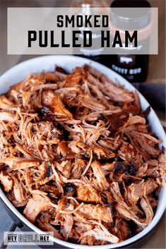 shredded pulled ham in a white bowl with text overlay that reads smoked pulled ham