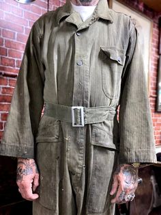 "Vintage WWII US Army 1st HBT model olive green utility garage mechanic coveralls jump suit outfit size 42R. Good used condition for the age, 13 stars buttons, multiples pocket on hip, chest and back, some stains and wear, check pictures. Made in Usa. Please, check carefully the measurements, photos and description of the article before buying it, we do not accept changes or returns. Measurements lying face down: (Model on the pics is 5.7 tall and 160 pounds weight.) 21\" Across chest underarm t Utility Garage, Mechanic Coveralls, Long Sleeve Outfit, 160 Pounds, Suit Outfit, Long Sleeve Outfits, Star Buttons, Jumpsuit Outfit, Us Army