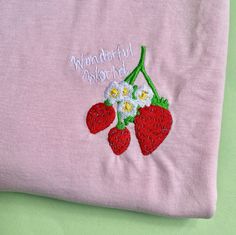 Strawberry Embroidered Tshirt 🍓🍓 Soft 100% Cotton. Unisex Fit. T-SHIRT INFO  The t-shirt is Stanley/Stella Organic 100% Cotton. We use sustainable fabric and fair trade certified. Sweatshop free and WRAP certified. T-shirt is embroidered to order. SIZING 🍓🍓 UK Sizes 🍓🍓 X-Small approx Size 6-8 Small approx Size 8-10 Medium  approx Size 12-14 Large  approx Size 16 X Large  approx Size 18 2XL approx Size 18-20 3XL approx 20-22 4XL approx 24 5XL approx 26 Embroidered Jumper, Embroidered Sweatshirt, Embroidered Tshirt, Embroidered Sweatshirts, Sustainable Fabrics, Wonders Of The World, Fair Trade, Strawberries, Black Tshirt