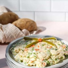 a plate full of mashed potatoes and green peppers