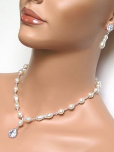 : ) Elegant Pearl Necklace With Rhinestones For Wedding, Classic Pearl Necklace With Diamond Accents For Wedding, Classic Wedding Pearl Necklace With Diamond Accents, Elegant Wedding Backdrop Necklace With Sparkling Stones, Crystal Pearl Necklace With Rhinestones For Wedding, Pearl White Rhinestone Necklace For Wedding, Elegant Bridal Necklace With Rhinestones For Wedding, Pearl Necklace With Diamond Accents For Wedding, Wedding Pearl Necklace With Diamond Accents