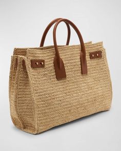 a straw bag with leather handles