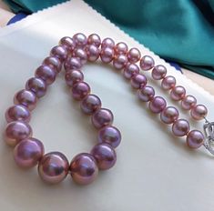 Stunning Edison Purple Pearls Beaded Necklace, 10-14mm, Rich Metallic Purple Color, Multicolored, Very High Luster.  Absolutely Eye Catching  Beauty!  Classic, Colorful and Stunning   Lustrous Beauty   Pearl ★ Pearl: Genuine Freshwater Edison Pearl ★ Size: 10-14mm ★ Shape: Near Round ★ Color: Natural untreated, Beautiful Metallic Purple Colors, Multicolored, Stunning ★ Luster: Wonderful, Very High Luster ★ Surface: Nice, Baby Smooth and Mirror Like, lightly spotted, gentle texture, Mostly Clean Luxury Purple Pearl Necklaces, Nice Baby, Edison Pearls, Purple Pearl, Pearl Choker, Pearl Size, Pearl Beads, Purple Color, Fresh Water