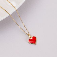 "14K Real Gold Red Heart Enamel Pendant, Dainty Minimalist Heart Necklace For Women, Solid Gold Red Enamel Pendant is a Perfect Gift for Her 📘 D E T A I L S * Solid Gold (real gold, no gold-filled or no gold plated material) * Karat: 14 K(585) * Gold color: Yellow * Pendant Width: 9 mm / Measurements may vary slightly due to handmade. ┈ C H A I N L E N G T H O P T I O N S * 14\" choker size (No adjustable option) * 15-16\" choker size (Adjustable ring at 15\"). * 16-18\" size (Adjustable ring a Enamel Heart Charm Necklace For Valentine's Day, Minimalist Red Heart-shaped Jewelry, Valentine's Day Enamel Heart Pendant Necklace, Red Heart Beads Necklace For Mother's Day, Red Heart Charm Necklace For Gift, Red Heart Necklace For Gift, Red Enamel Heart Pendant Necklace, Red Heart Necklace For Gifts, Red Heart-shaped Enamel Jewelry