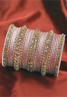 Alloy Based Bangles in Pink and Golden Allured with Stones This set consists of 26 Bangles Cheap Bohemian Party Bangle, Luxury Jeweled Bangle For Festive Season, Luxury Hand Set Bangle For Diwali, Luxury Pink Bangle For Wedding, Luxury Hand Set Dazzling Bangle, Luxury Bangle For Reception, Bohemian Luxury Bangle For Wedding, Luxury Hand-set Engagement Bangle, Luxury Hand Set Bangle For Festive Season