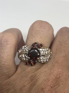 Vintage Red Bohemian Garnet White Sapphire 925 Sterling Silver Cocktail Statement Lovely Bohemian Garnet and white sapphire ring 925 Sterling silver Size 8 but can be re sized for you on request, my jeweler charges $10-$20 All rings are shipped in a nice gift box. Check out our over a THOUSAND great reviews Engraving is $4 per letter and is not always perfect depending on the piece. It can take a few days if the jeweler is busy. This is payable to Paypal Judithsltd@gmail.com Red Multi-stone Cluster Jewelry, Unique Red Diamond Jewelry, Elegant Red Multi-stone Jewelry, Red Cluster Jewelry With Diamond Accents, Elegant Red Rings With Stones, Red Multi-stone Cubic Zirconia Jewelry, Vintage Red Cluster Jewelry, Silver Cocktail, Garnet Gem