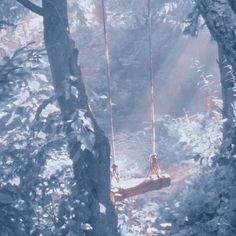 a swing suspended in the middle of a forest