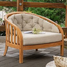 a wooden chair sitting on top of a patio