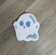 a close up of a towel with a face on it