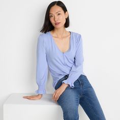 A three-quarter sleeve top is the perfect option for in between seasons. This one has smocking on the sleeves so you can wear it however you like: sleeves down for more coverage or pushed up higher on your arm. The V-neck is flattering but modest and the full button-front closure has a built-in placket underneath to keep your bra from peeking through. The A-line silhouette gives you flattering ease and will look great with anything from jeans to your favorite skirt. Long Sleeve Smocked Top For Day Out, Trendy Tops With 3/4 Sleeves For Brunch, Versatile 3/4 Sleeve Spring Blouse, Long Sleeve Smocked Stretch Top For Brunch, Versatile Long Sleeve Top For Spring, 3/4 Sleeve Tops For Spring Casual Gatherings, Spring 3/4 Sleeve Tops For Casual Gatherings, 3/4 Sleeve Tops For Casual Spring Gatherings, Spring Versatile Tops With 3/4 Sleeves