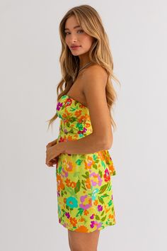 Ready for a dose of vacation bliss? Our Vacay Vibes Mini Dress is your ticket to a stylish getaway! Pack this must-have mini dress for your next adventure, and let it be a reminder of sun-kissed days and unforgettable memories. 100% Polyester Color: Lime Green Floral Print Strapless Back Tie Tube Style Mini Length Vacay Vibes, Kiss Day, Green Floral Print, Tube Dress, Floral Mini Dress, Sun Kissed, Egift Card, Lime Green, Must Haves