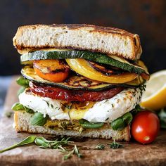 a grilled sandwich with tomatoes, zucchini and mozzarella