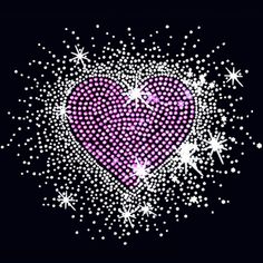 a pink heart with lots of sparkles on it in the dark night time sky