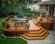 a wooden deck with steps leading up to it