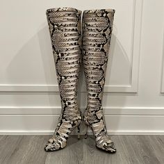 Vince Camuto Over The Knee Gladiator Peep Toe In Snakeskin Size 5.5. Okaaayy!!!! I Have Serious Size Envy Right Now! These Are Hot And So Glad They Are Back In! Low Comfortable Heel. Back Zip Ends Below/At The Knee For Zero Irritation. Plus It Just Looks So Much Better Then A Full Zip! These Are The Perfect Gladiator! Please Notethese Absolutely Can Come With The Box And Original Packaging But It’s Over Posh’s Size Limit Which Will Incur Extra Shipping Costs Which Will Be Added After Purchase. S Fitted Beige Boots With Leather Sole, Fitted Snip Toe Heels For Fall, Beige Fitted Snip Toe Boots, Fitted Beige Snip Toe Boots, Fitted Open Toe Boots With 4-inch Heel, Luxury Fitted Closed Toe Boots, Designer Fitted Boots With Closed Toe, Beige Boots With Padded Heel, Fitted Beige Boots With Padded Heel