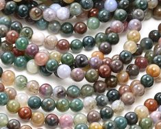 multicolored agate beads on white background