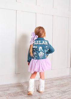 This adorable fairy denim jacket will be sure to make heads turn. Jackets are made once ordered. The layout will be arranged to fit the space of the jacket. This is a handmade item so the product may vary. This is a perfect staple to add to any outfit!  Details Soft fabric with a hint of spandex offers a comfy and stretchy fit The button-front design allows for easy layering Multiple pockets add functional flair to her look Can be worn buttoned up or open to create a variety of cute looks Pearl Name Patches and gems are an add-on. Please specify the names and hair color of the fairy in the notes. Big Girl Sizes we suggest sizing up Patched Denim Jacket, Denim Jacket Patches, Name Patches, Mermaid Gifts, Patches Jacket, Girls Jacket, Front Design, Etsy Fashion, Denim Fashion