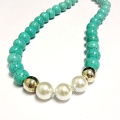 This turquoise and pearl necklace created by Jewelry By Carmal is made of smooth round turquoise howlite gemstones, white fresh water pearls, sterling silver: beads, lobster claw clasp and findings. This necklace measures 19 1/2 inches in length. View more beaded necklaces: http://www.etsy.com/shop/jewelrybycarmal?section_id=7999556 All of our jewelry arrives wrapped and ready for gift giving. We offer free standard shipping, via USPS, within the United States. Please see other items in our shop Handmade Turquoise Pearl Necklace, Adjustable Turquoise Pearl Necklace With Round Beads, Turquoise Pearl Necklace With Natural Stones, Turquoise Round Beads Pearl Necklace With Natural Stones, Turquoise Pearl Necklace With Natural Round Beads, Turquoise Pearl Jewelry With Round Beads, Handmade Turquoise Pearl Necklace With Round Beads, Adjustable Turquoise Single Strand Pearl Necklace, Turquoise Beaded Pearl Necklace